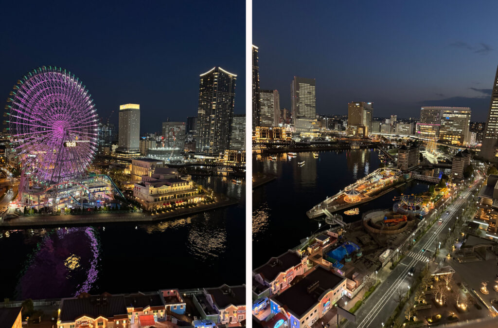 部屋から見える夜のみなとみらいの観覧車とライトアップされた街並み